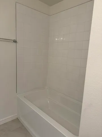 a close view of a bathtub in bathroom