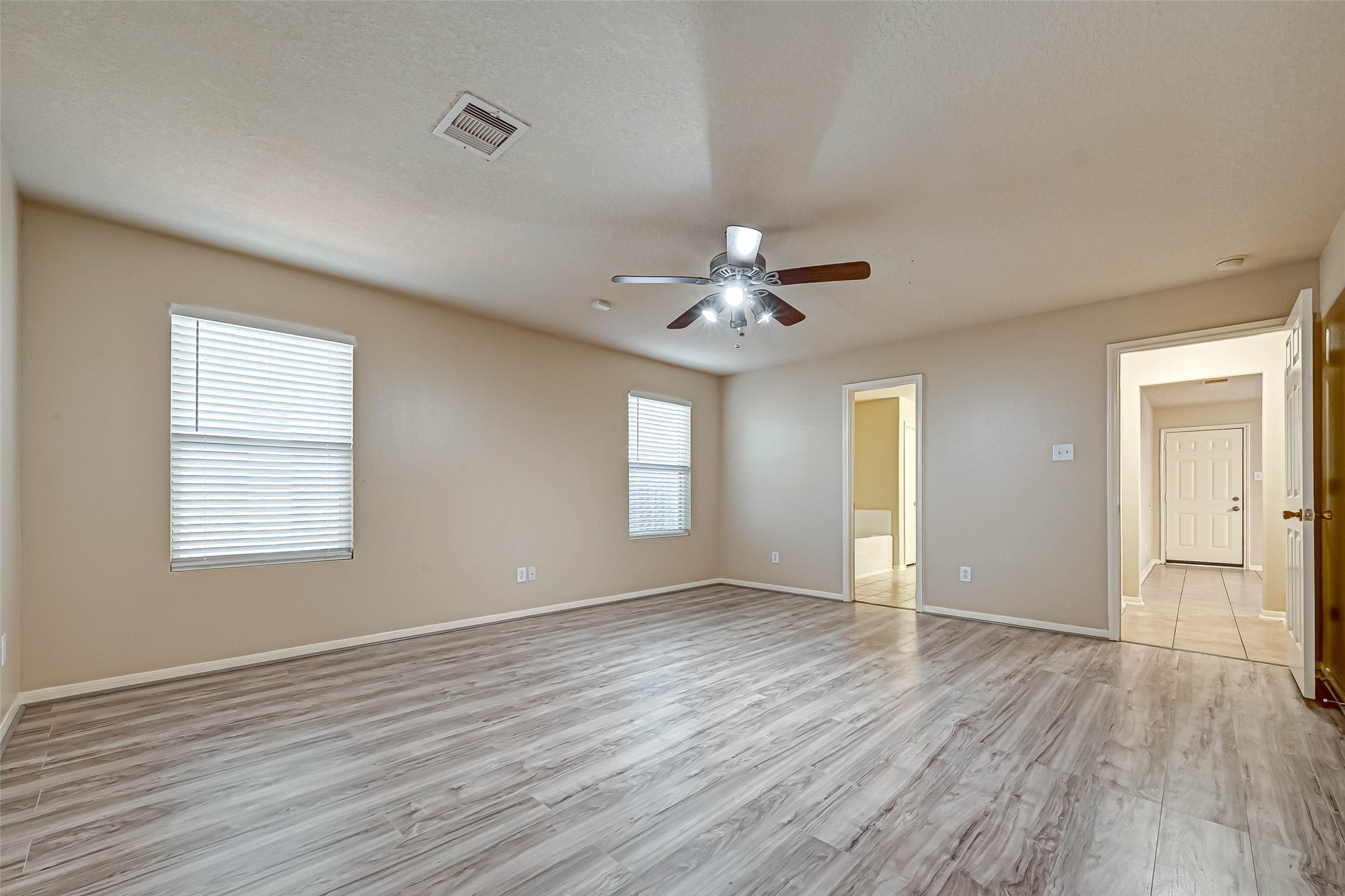 3522 Clipper Winds Way Houston, TX 77084 - Photo 34 of 48 a view of an empty room with wooden floor and a window