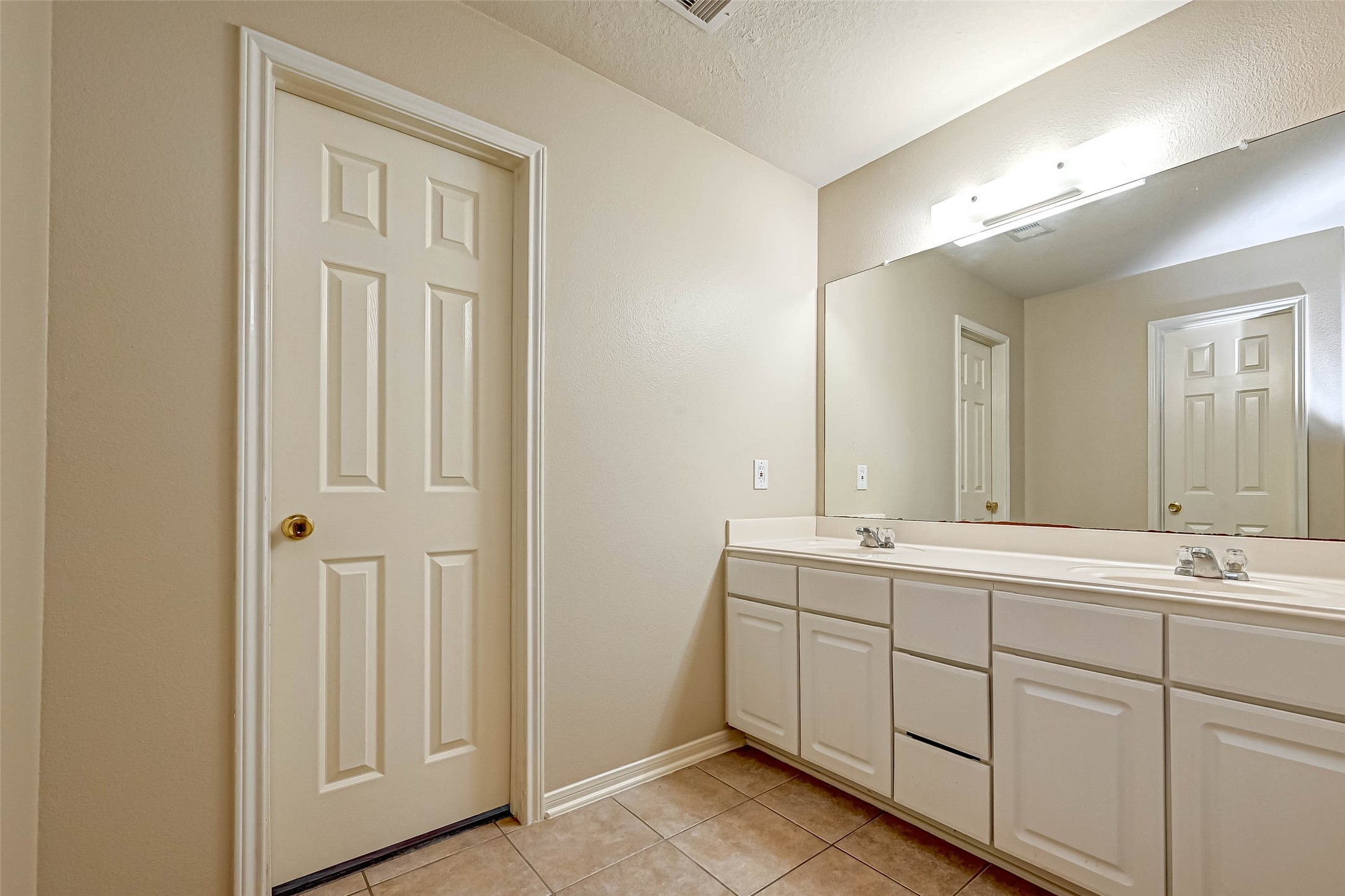 3522 Clipper Winds Way Houston, TX 77084 - Photo 37 of 48 a bathroom with a double vanity sink and mirror