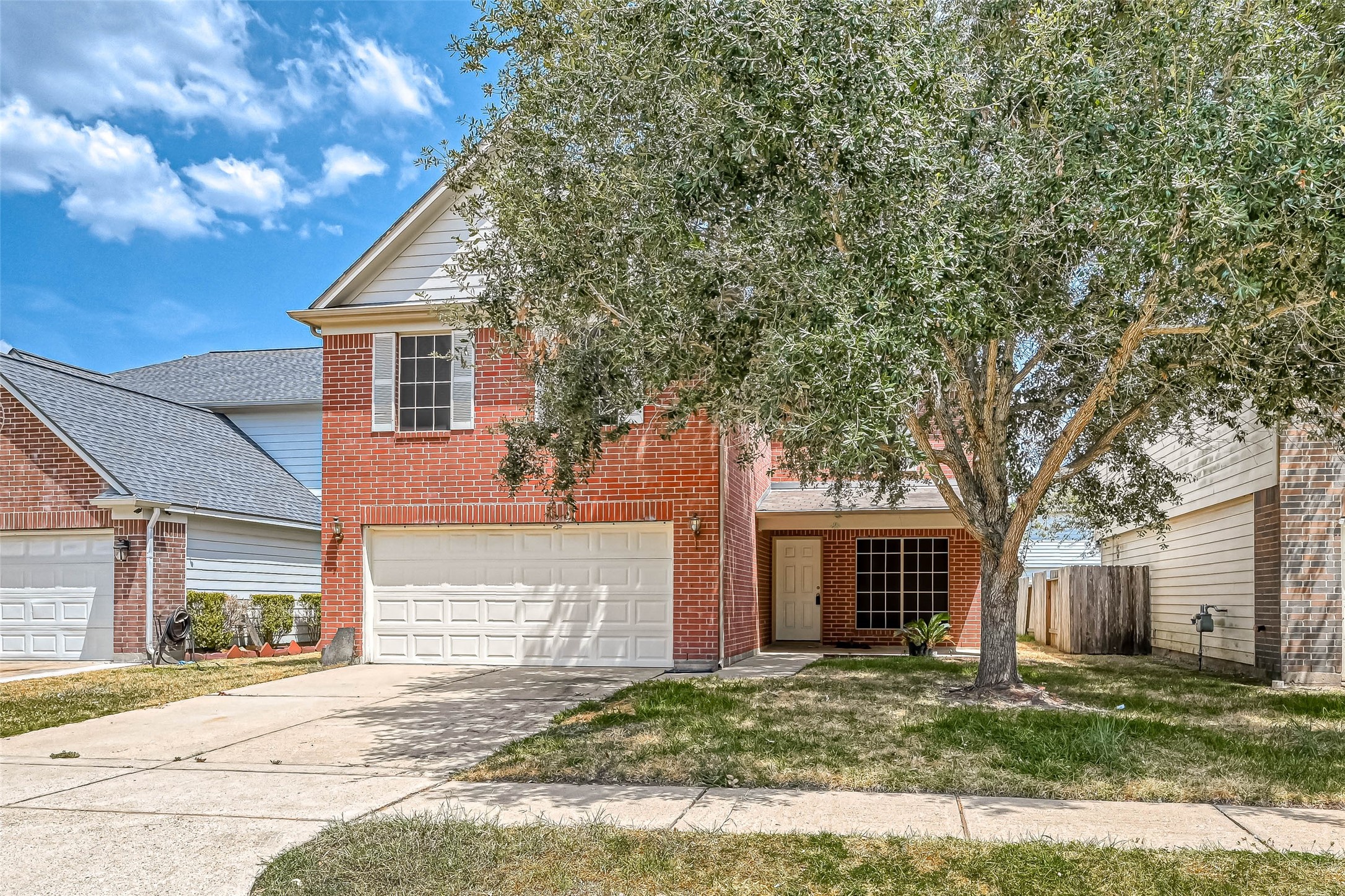 3522 Clipper Winds Way Houston, TX 77084 - Photo 4 of 48 a front view of a house with a yard and garage