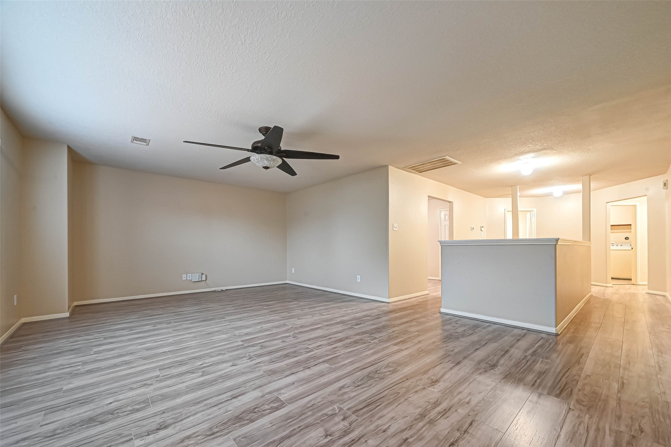 3522 Clipper Winds Way Houston, TX 77084 - Photo 42 of 48 wooden floor in an empty room with a window