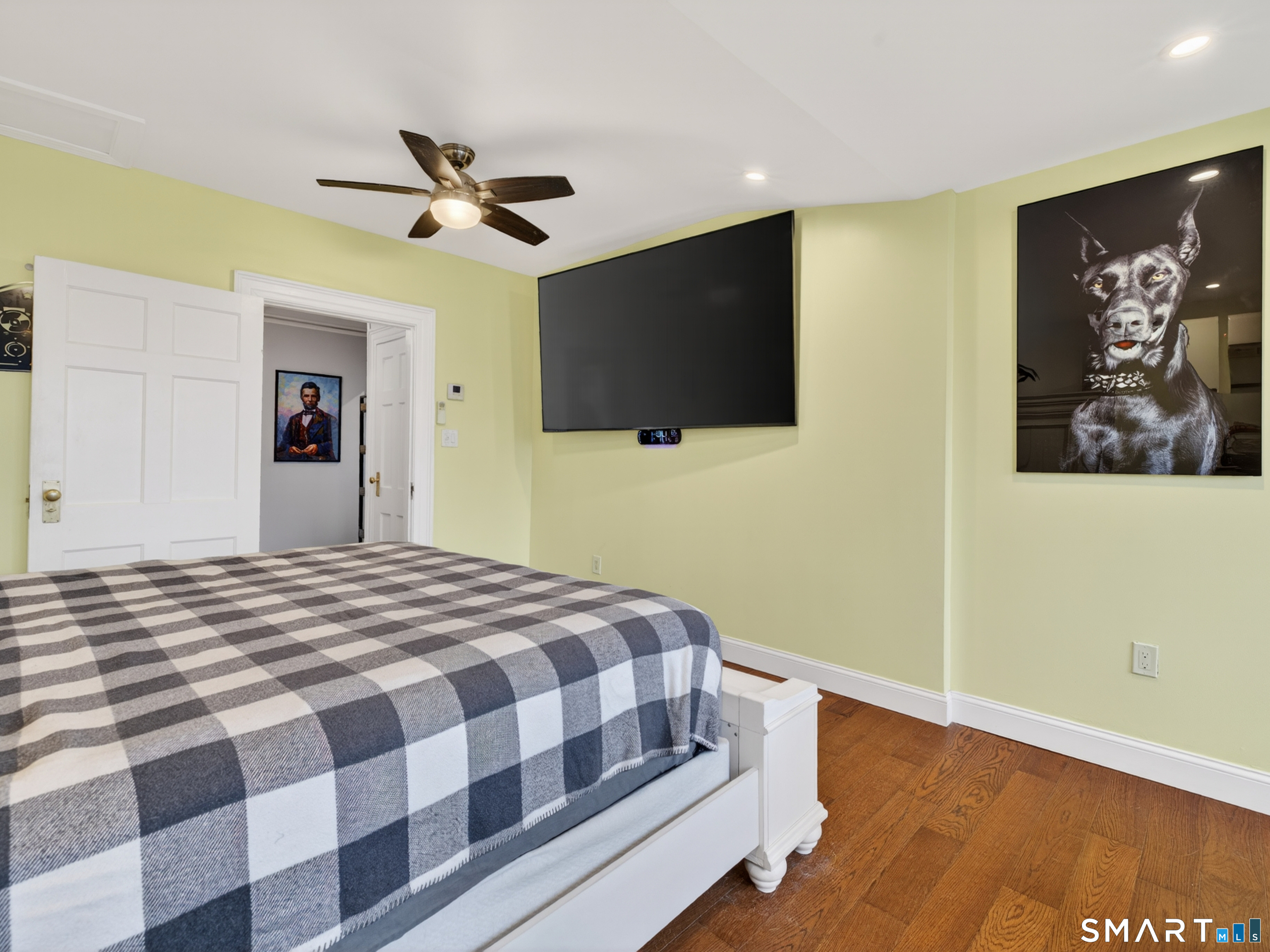 76 Starr Hill Road Groton, CT 06340 - Photo 18 of 40 a bedroom with a bed and a flat screen tv