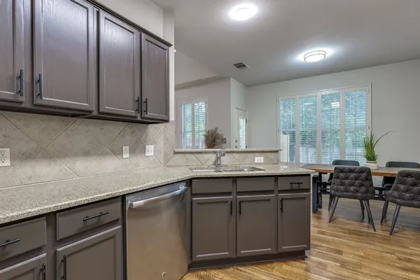 a kitchen with a stove and a microwave