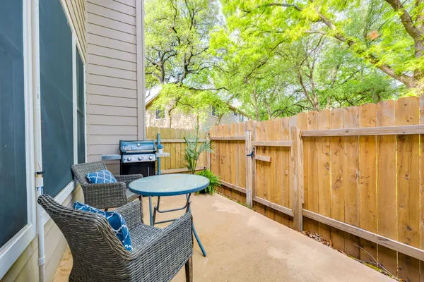 a view of a balcony with table and chairs