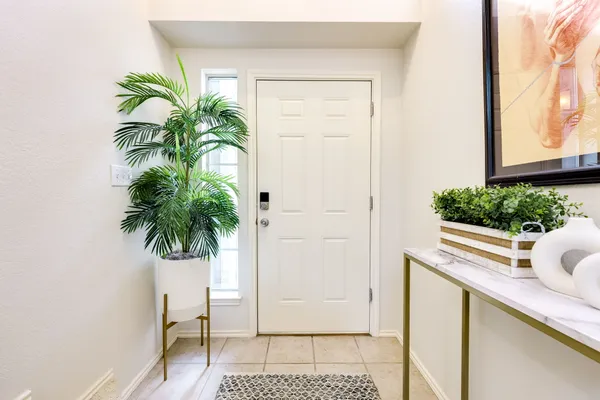 a potted plant sitting on a dresser next to a yard