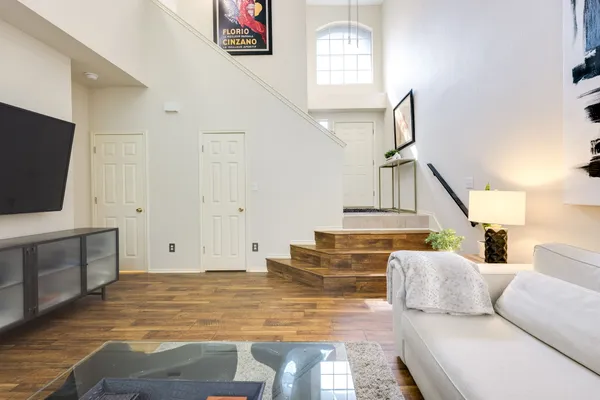 a living room with furniture and a flat screen tv