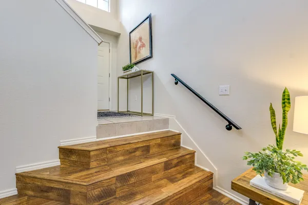 a living room with furniture and a lamp