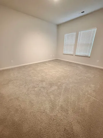 a bathroom with a shower sink and mirror