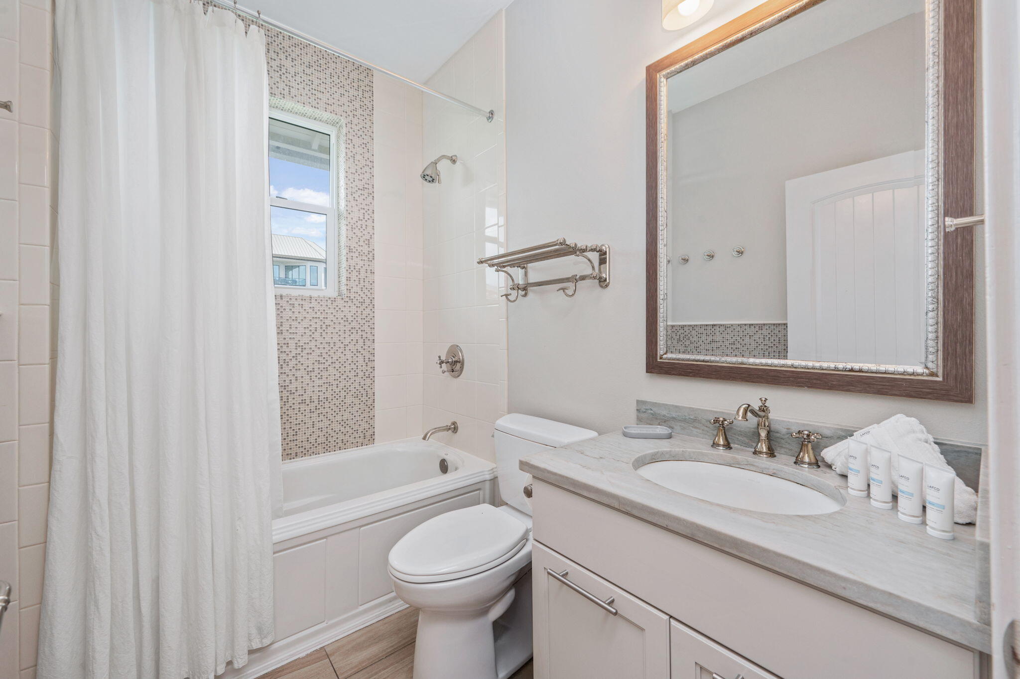 4525-4499 West County Highway 30A Santa Rosa Beach, FL 32459 - Photo 106 of 130 a bathroom with a granite countertop sink toilet and shower