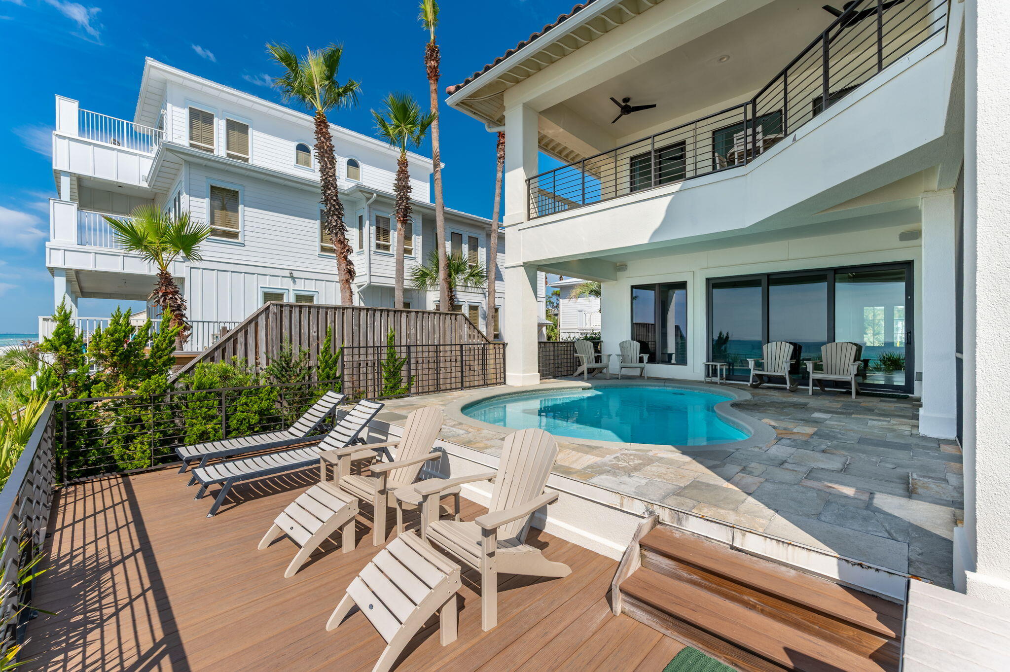 4525-4499 West County Highway 30A Santa Rosa Beach, FL 32459 - Photo 113 of 130 a view of a patio with couches table and chairs and potted plants