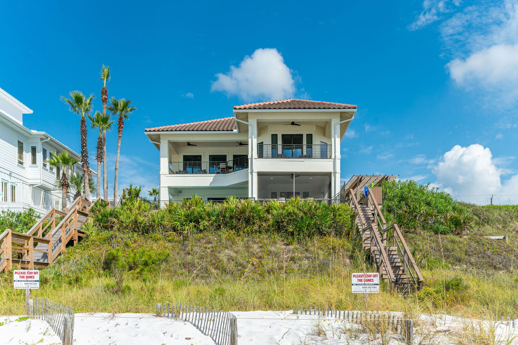 4525-4499 West County Highway 30A Santa Rosa Beach, FL 32459 - Photo 115 of 130 a front view of a house with a yard
