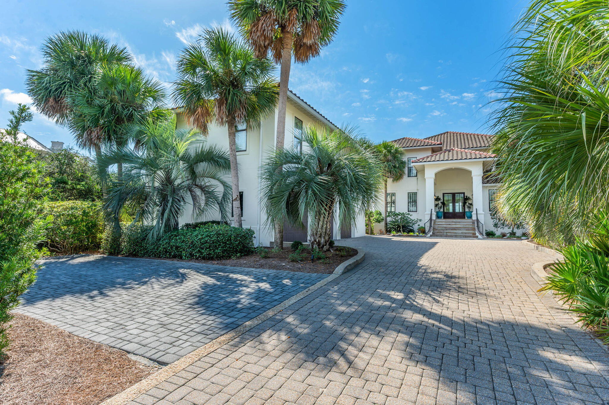 4525-4499 West County Highway 30A Santa Rosa Beach, FL 32459 - Photo 118 of 130 front view of a house with a yard and palm trees