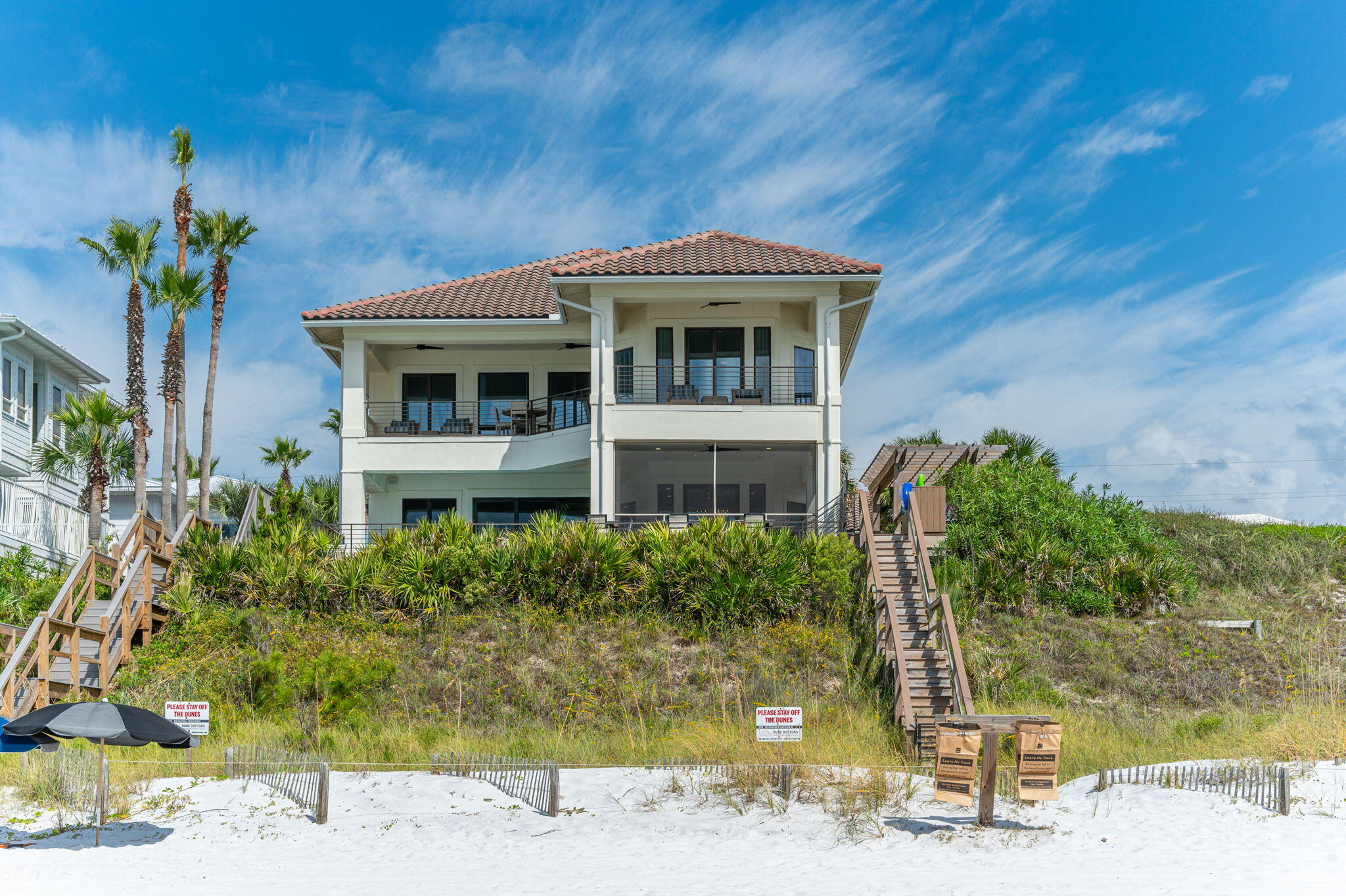 4525-4499 West County Highway 30A Santa Rosa Beach, FL 32459 - Photo 15 of 130 a front view of a house with a yard