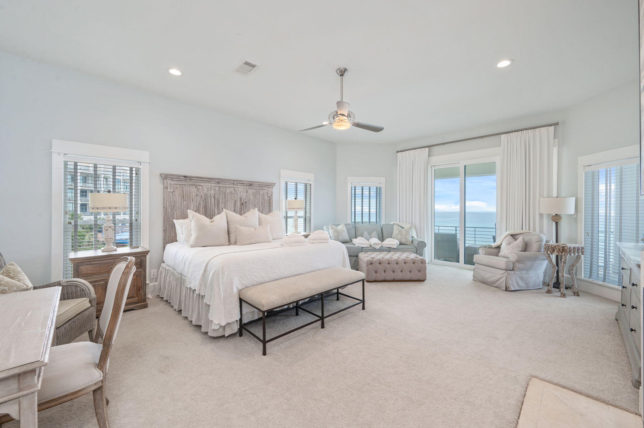4525-4499 West County Highway 30A Santa Rosa Beach, FL 32459 - Photo 70 of 130 a spacious bedroom with a bed a couch and large window