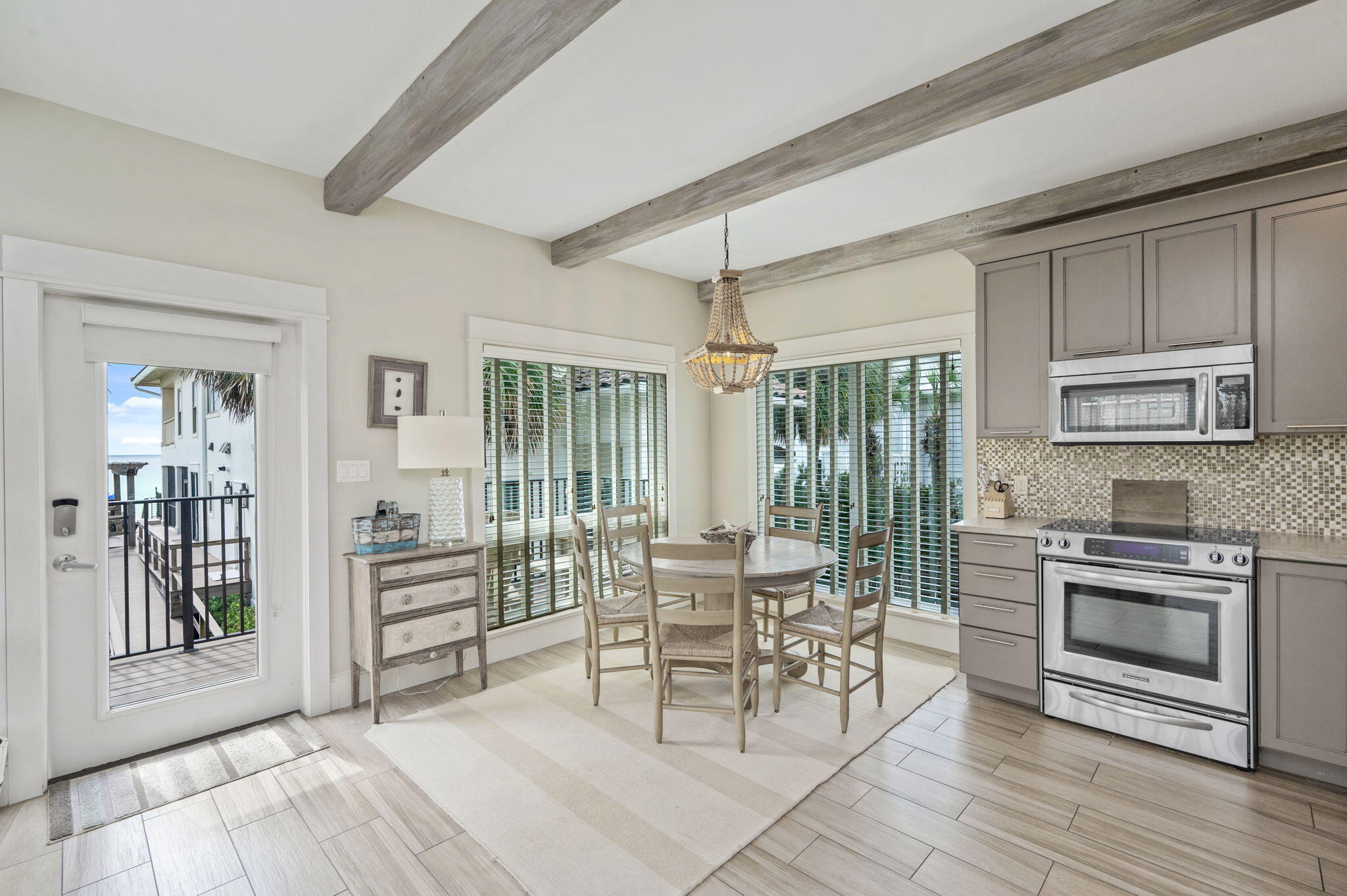 4525-4499 West County Highway 30A Santa Rosa Beach, FL 32459 - Photo 100 of 130 a living room with furniture a flat screen tv and a stove