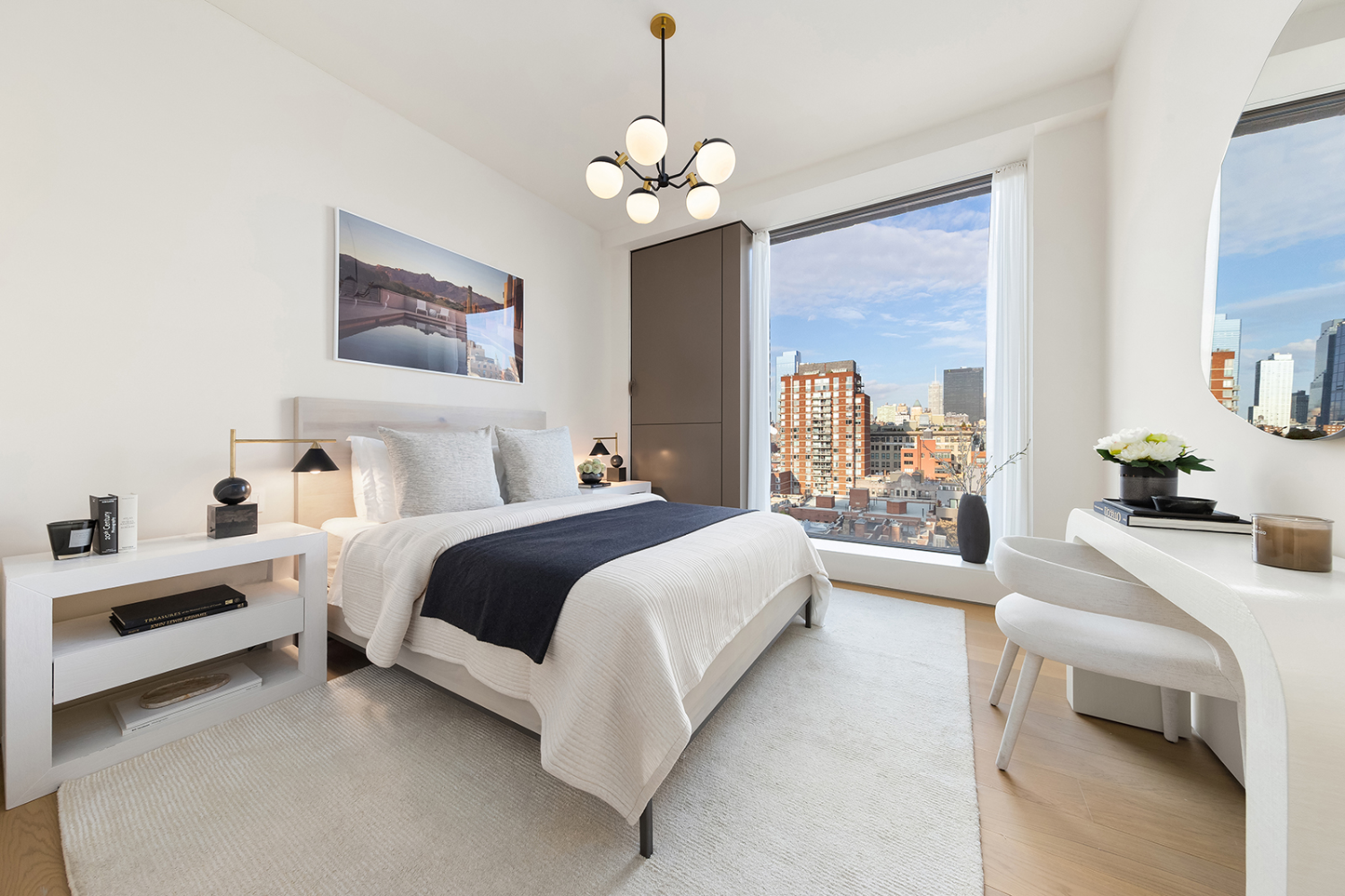 251 West 14th Street, Unit PH Manhattan, NY 10011 - Photo 11 of 13 a bedroom with a bed and a chandelier