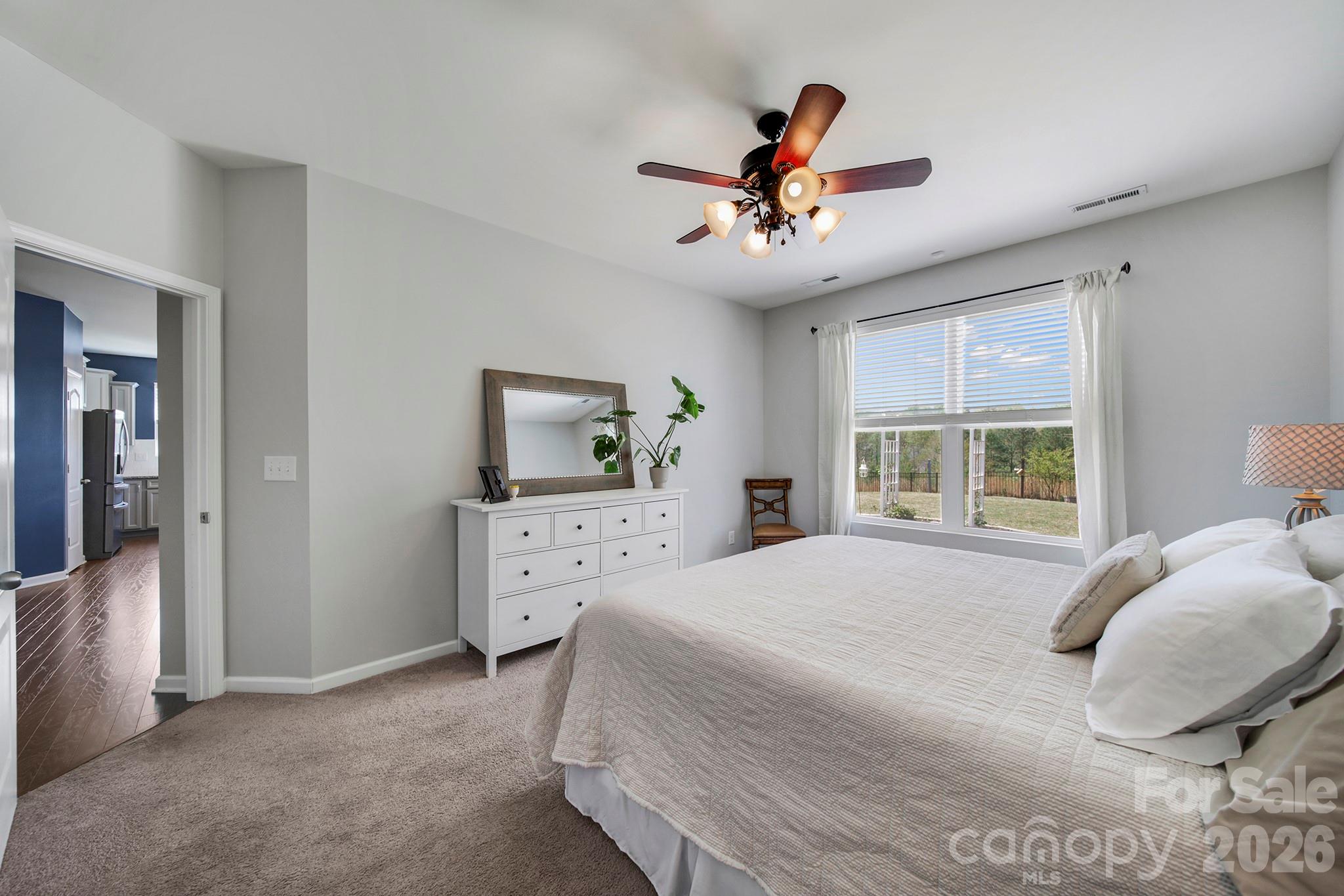 2217 Attaran Lane Lancaster, SC 29720 - Photo 11 of 25 a bedroom with a bed and a chandelier