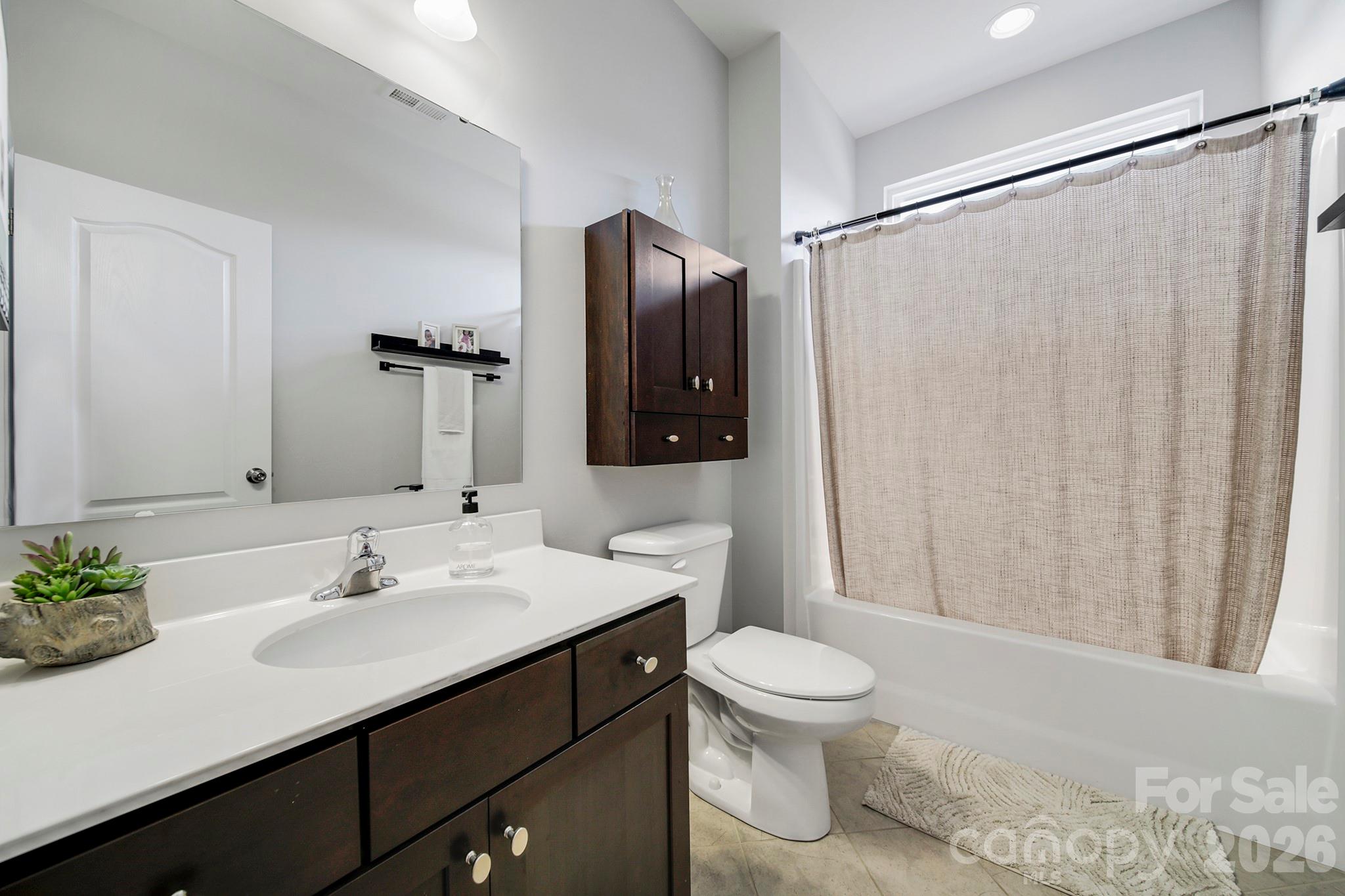 2217 Attaran Lane Lancaster, SC 29720 - Photo 17 of 25 a bathroom with a sink toilet and shower