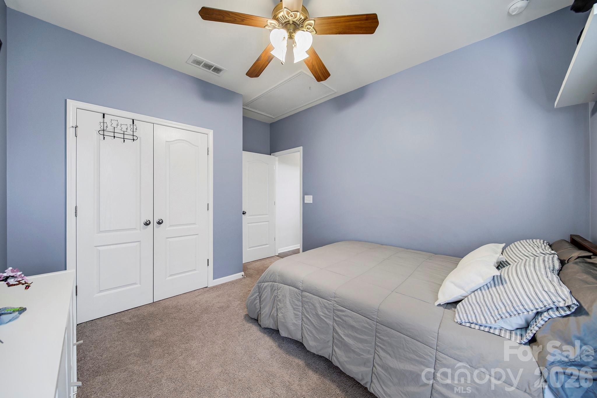 2217 Attaran Lane Lancaster, SC 29720 - Photo 19 of 25 a bedroom with a bed and a chandelier