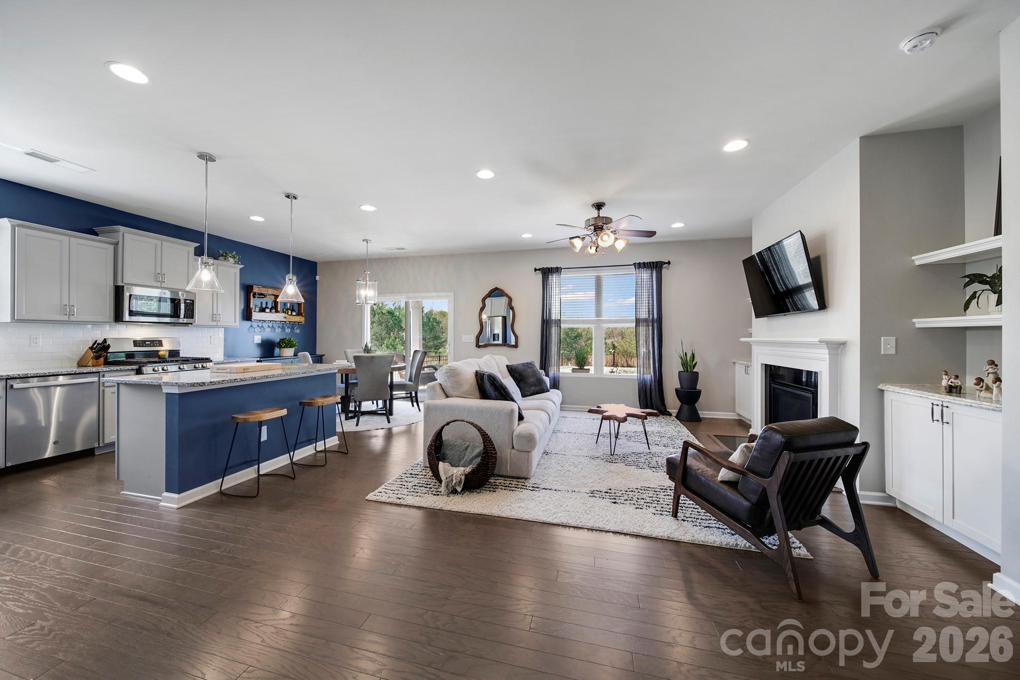 2217 Attaran Lane Lancaster, SC 29720 - Photo 4 of 25 a living room with fireplace furniture and a wooden floor