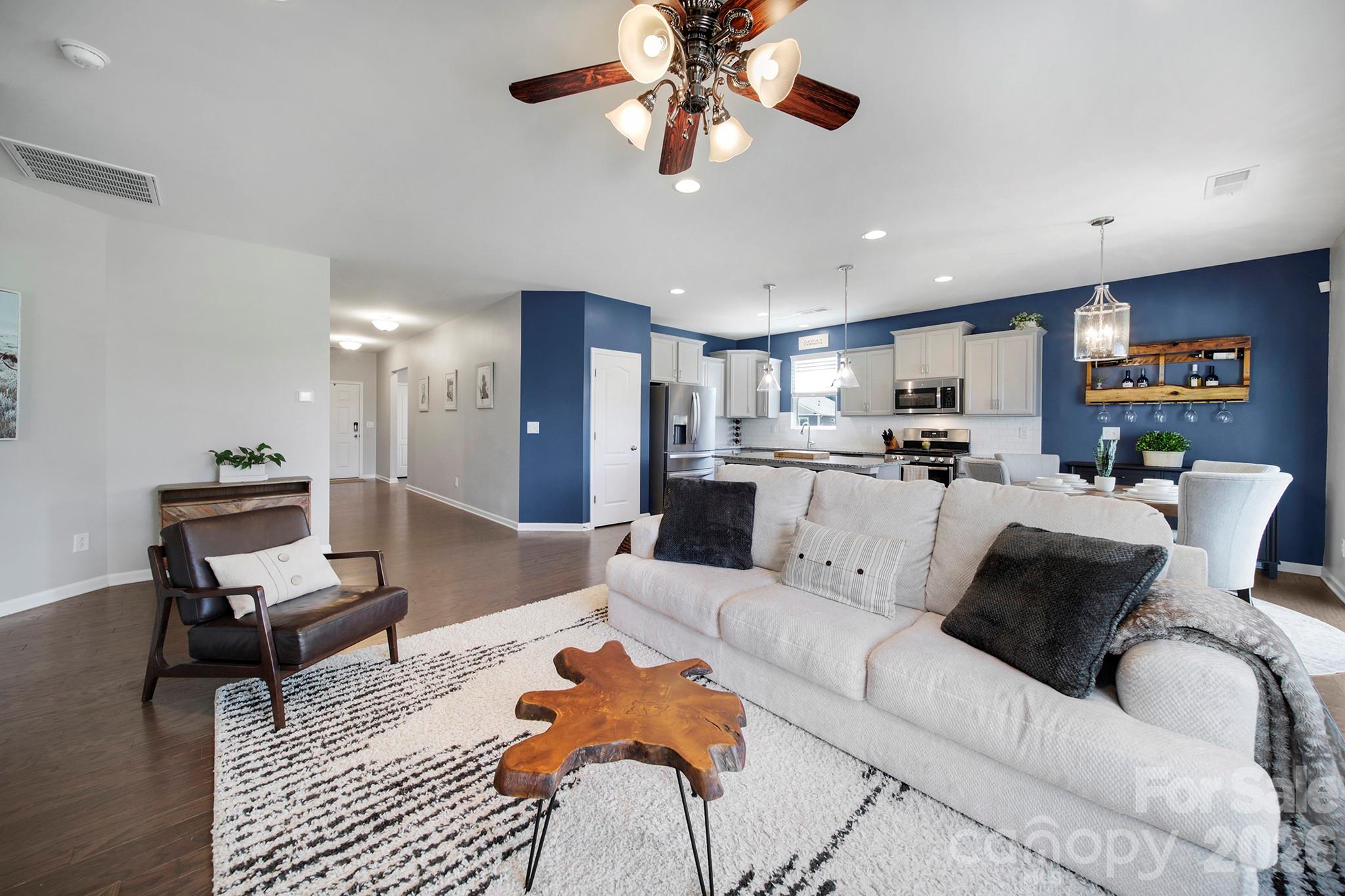 2217 Attaran Lane Lancaster, SC 29720 - Photo 5 of 25 a living room with furniture kitchen view and a chandelier
