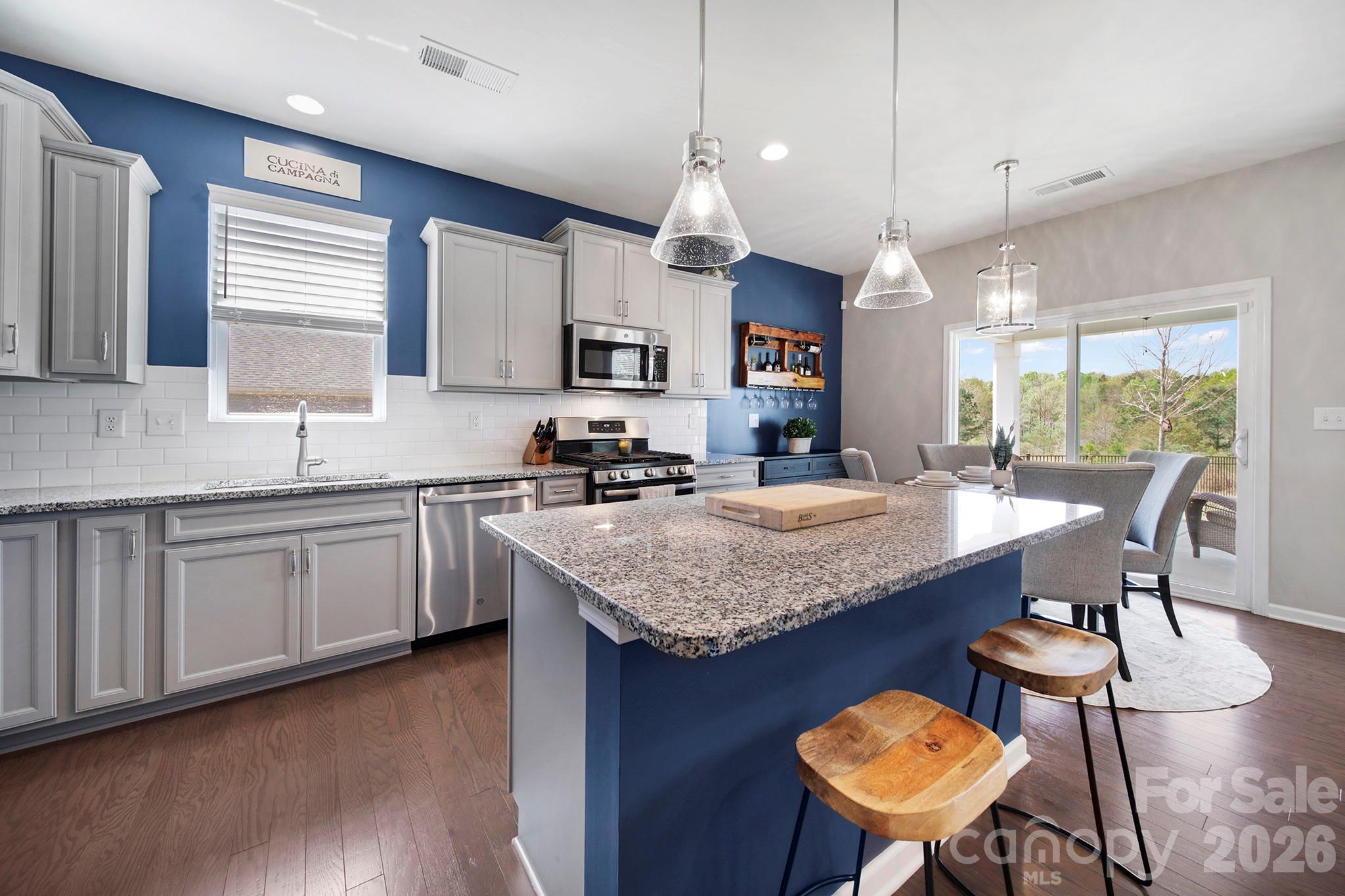 2217 Attaran Lane Lancaster, SC 29720 - Photo 8 of 25 a kitchen with center island table and chairs
