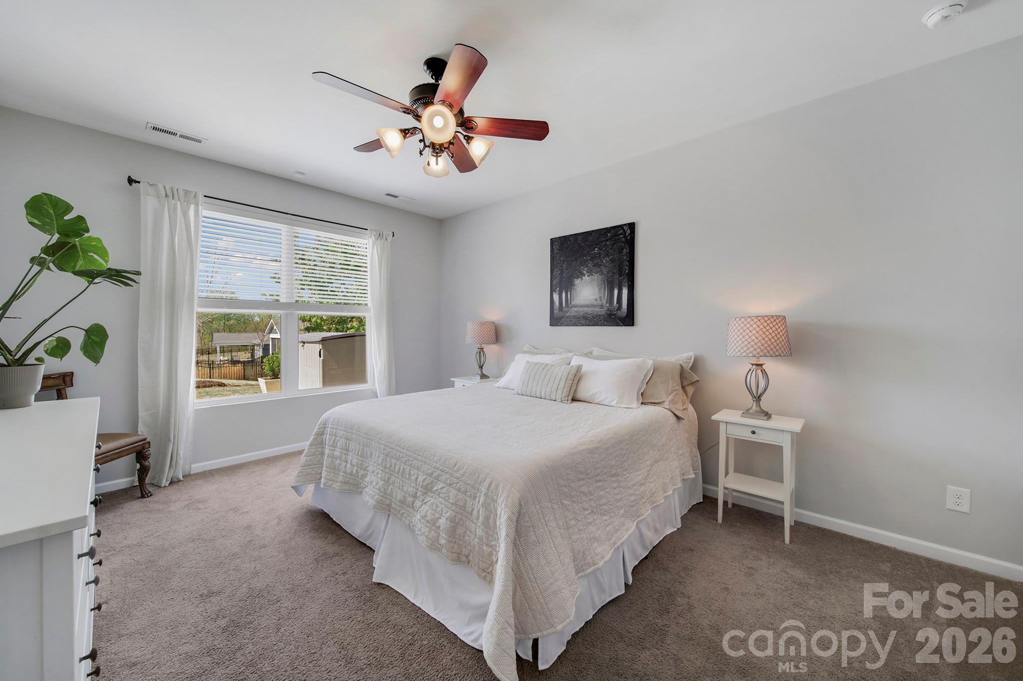 2217 Attaran Lane Lancaster, SC 29720 - Photo 10 of 25 a bedroom with a large bed and a window