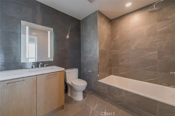 a bathroom with a sink a toilet and a bathtub