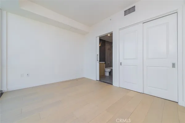 a view of a bedroom with washer and dryer