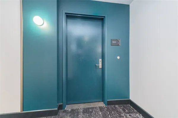 a kitchen with stainless steel appliances granite countertop a refrigerator a sink and a stove