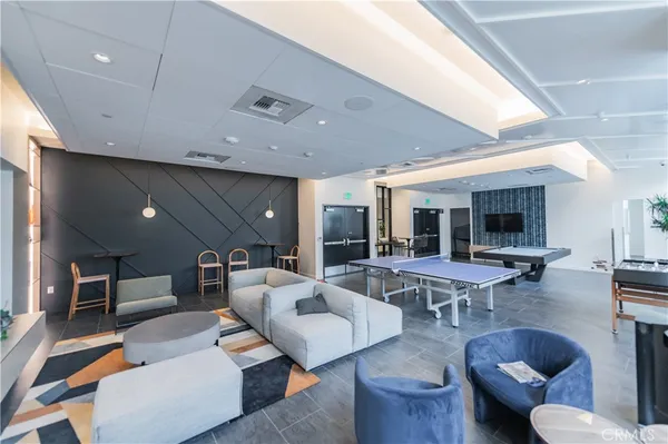 a outdoor dining space with furniture and kitchen view