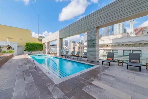 a bathroom with a mirror and a shower