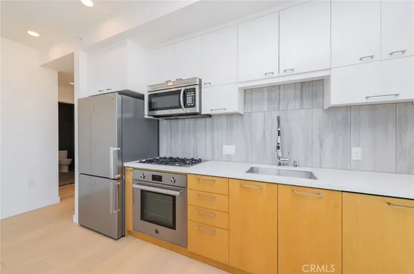 a view of hallway with a bathroom