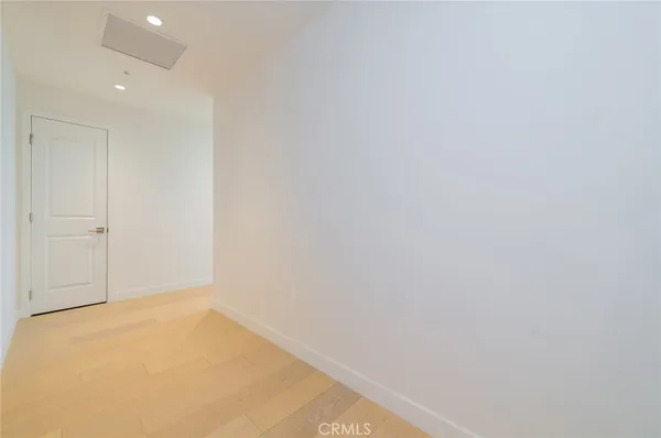 an empty room with large windows