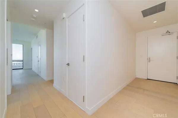 an empty room with closet area