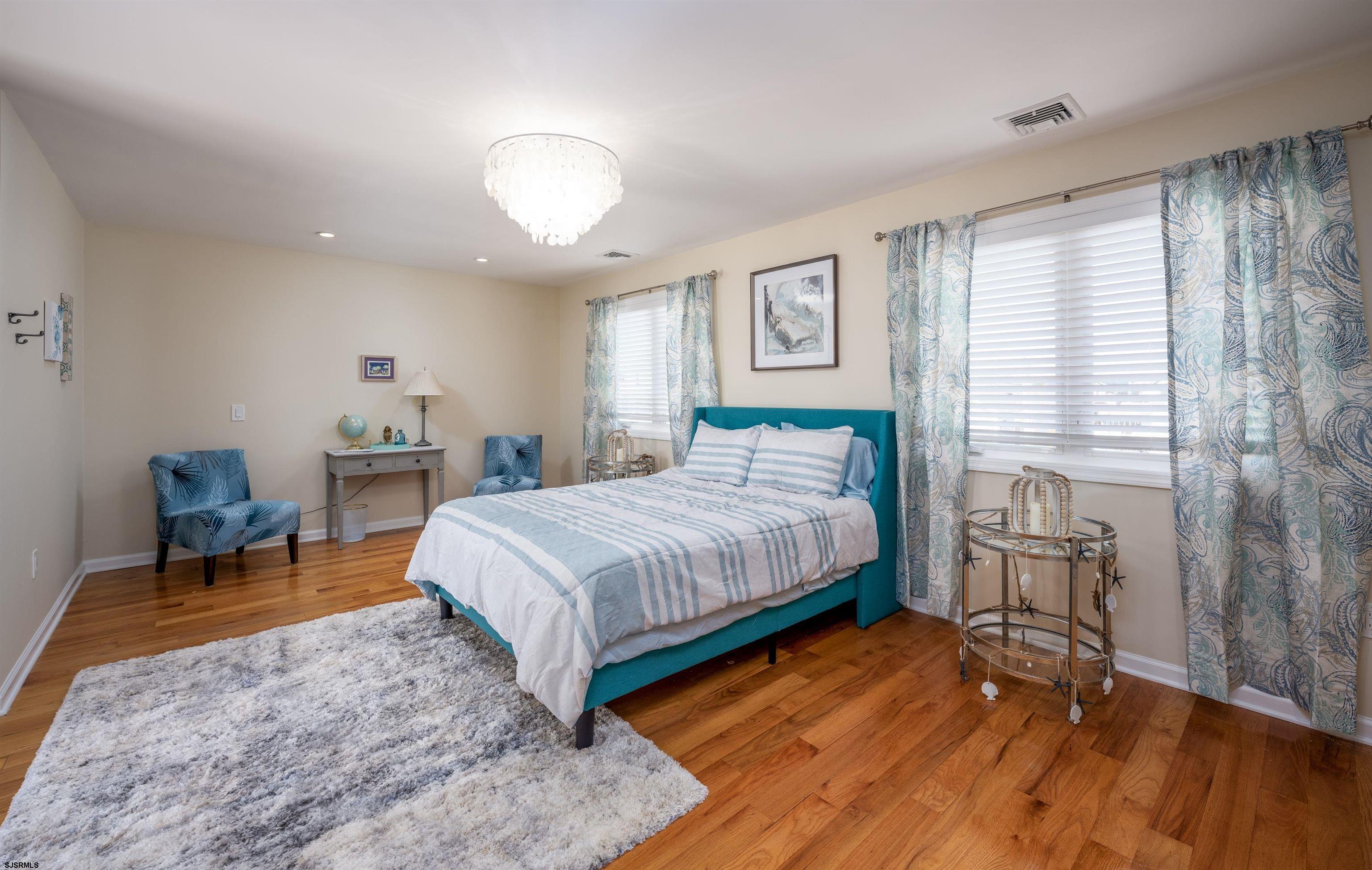 113 Marlin Road Tuckerton, NJ 08087 - Photo 6 of 14 a bedroom with a bed and wooden floor