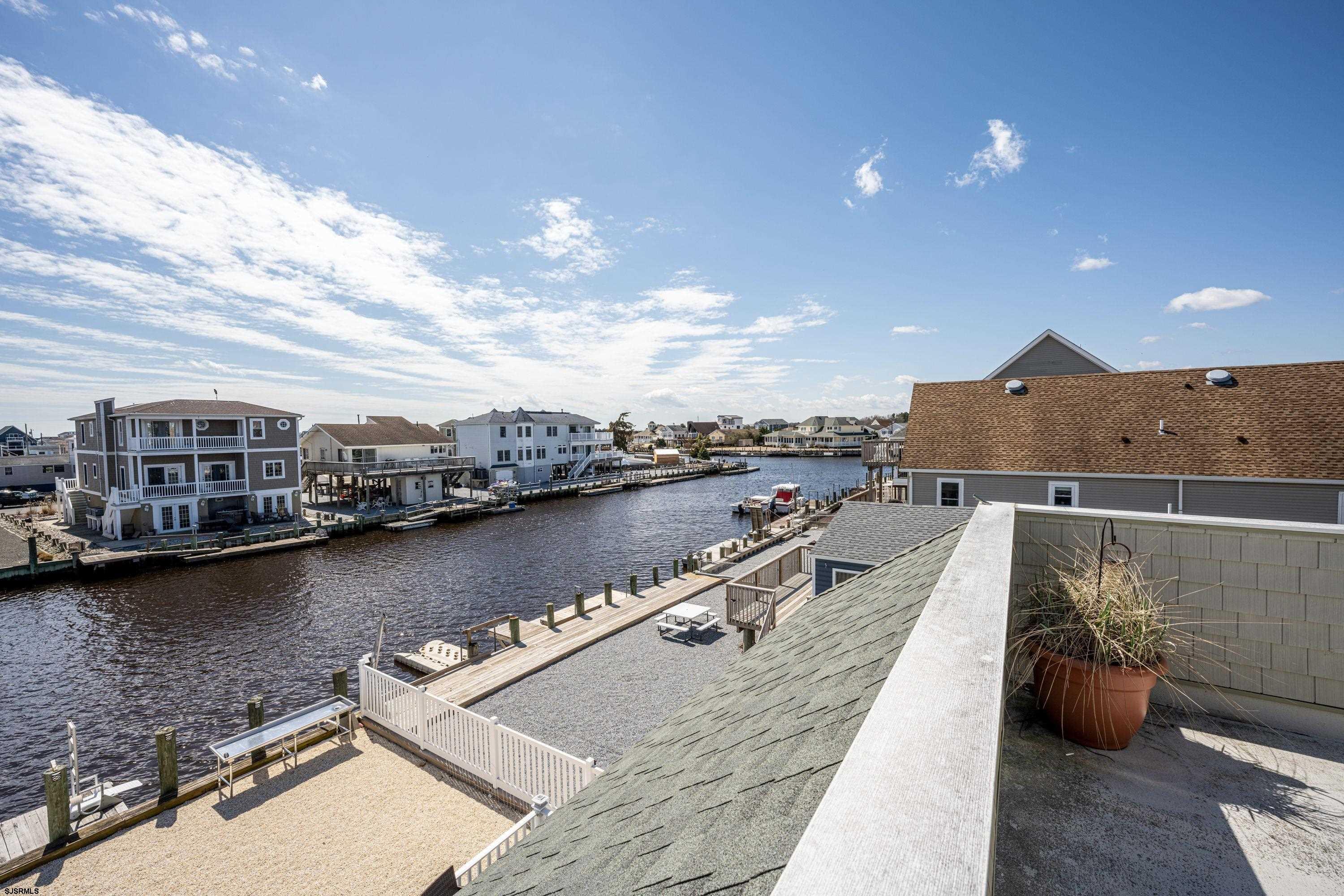 113 Marlin Road Tuckerton, NJ 08087 - Photo 8 of 14 a view of a lake with a terrace