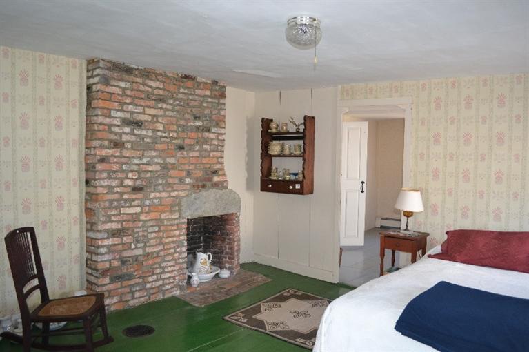 105 Spring Hill Road East Sandwich, MA 02537 - Photo 17 of 33 a bedroom with a bed and a chair