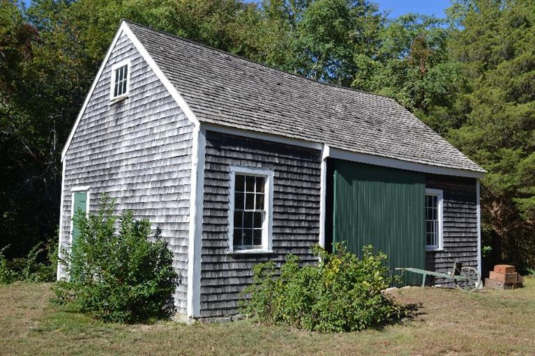 105 Spring Hill Road East Sandwich, MA 02537 - Photo 21 of 33 a view of a house with large windows and a small yard