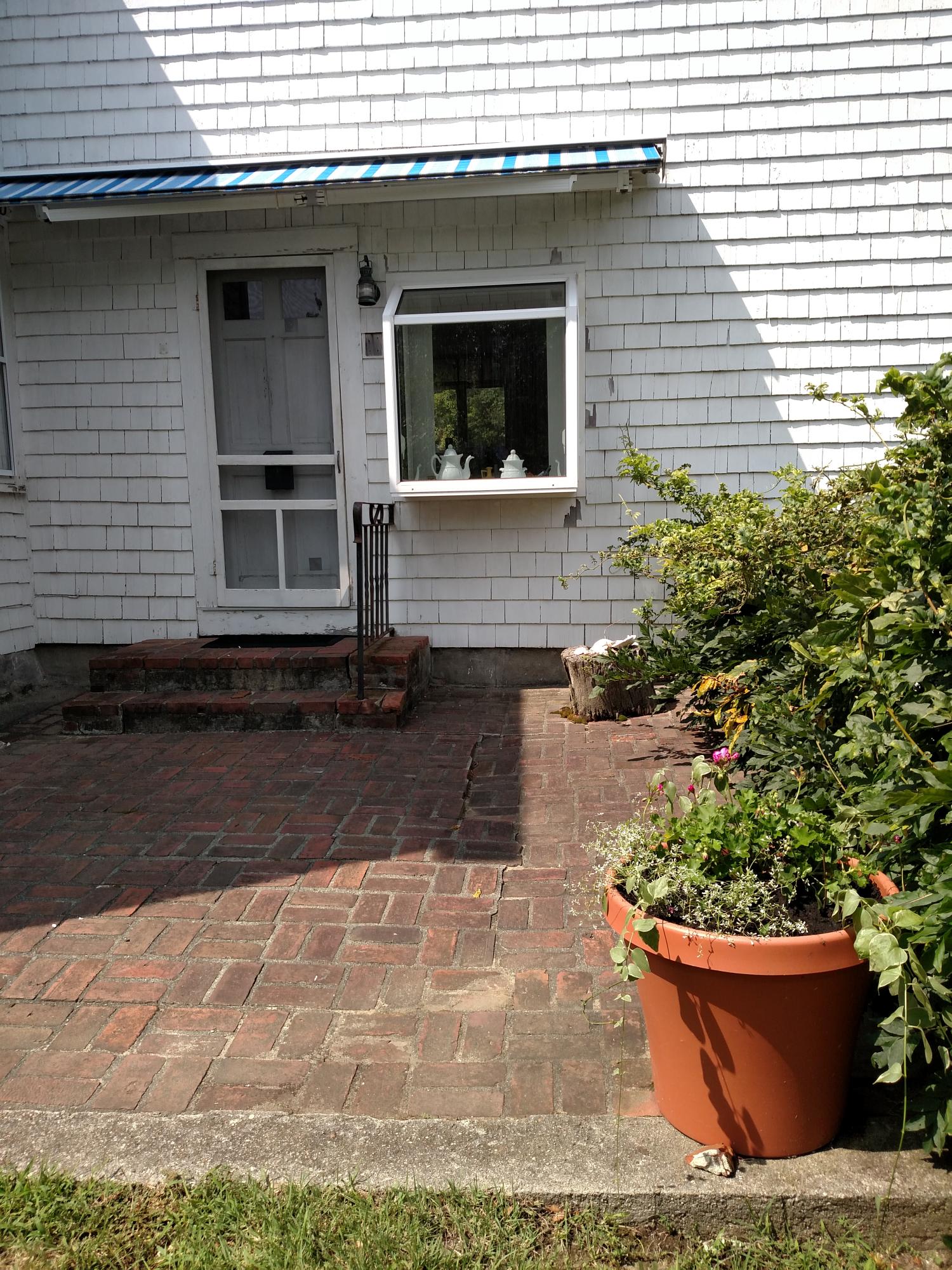 105 Spring Hill Road East Sandwich, MA 02537 - Photo 32 of 33 a front view of a house with garden