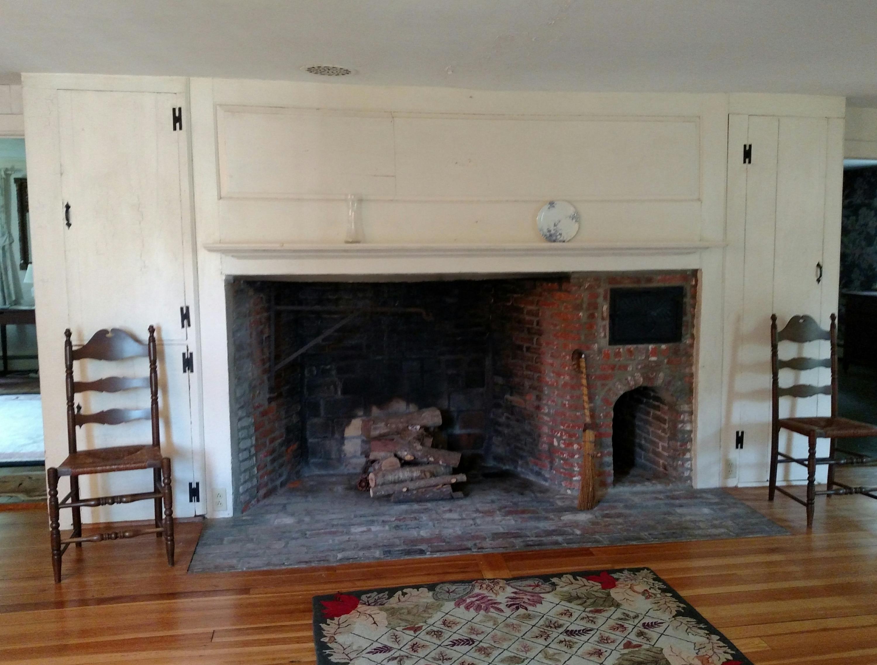 105 Spring Hill Road East Sandwich, MA 02537 - Photo 10 of 33 a living room with furniture and a fireplace