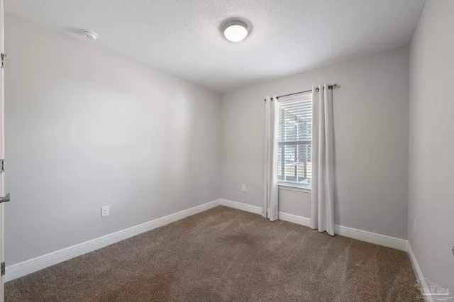 wooden floor with white walls