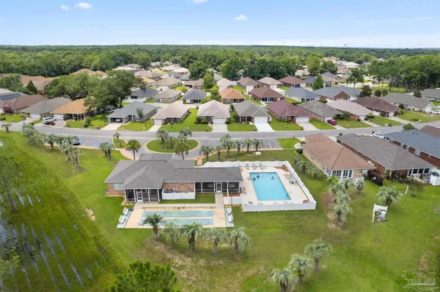 an aerial view of a house with a garden