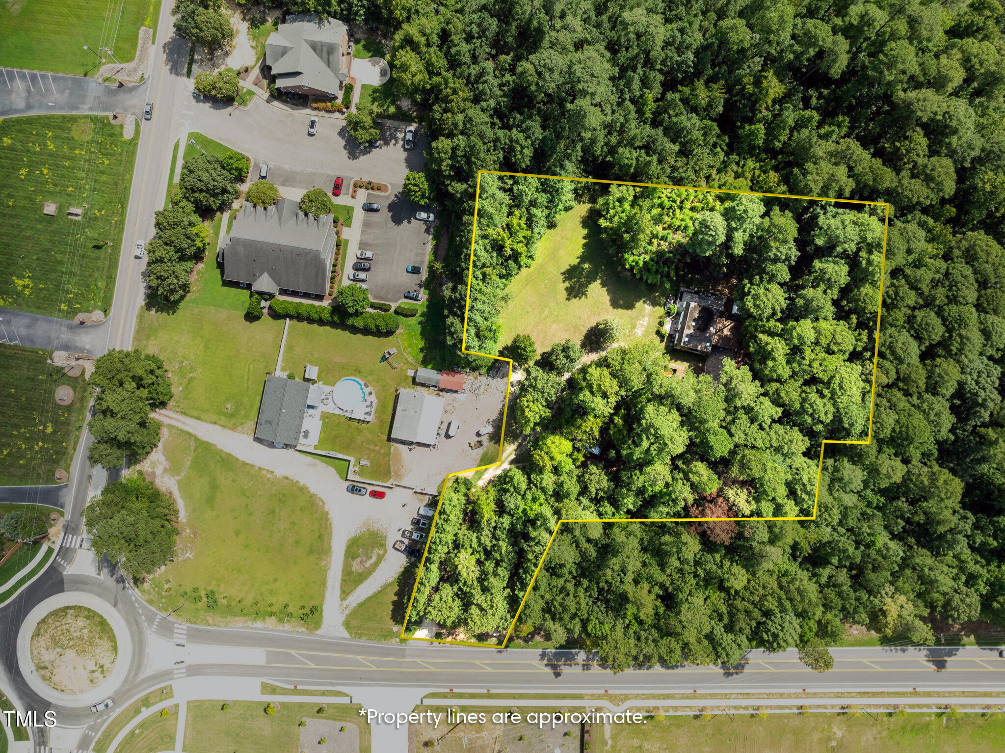 7416 Forestville Road Knightdale, NC 27545 - Photo 11 of 14 an aerial view of a house with a yard basket ball court and outdoor seating