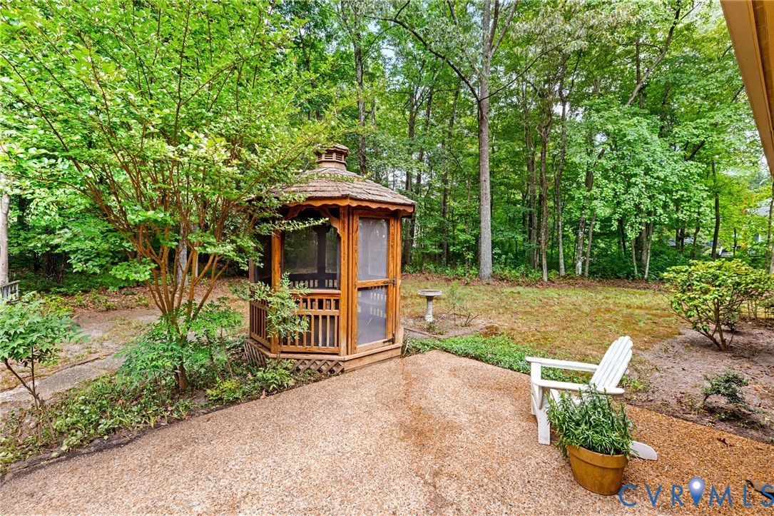 2615 Salisbury Road Midlothian, VA 23113 - Photo 28 of 36 a view of a chair and table in backyard of the house