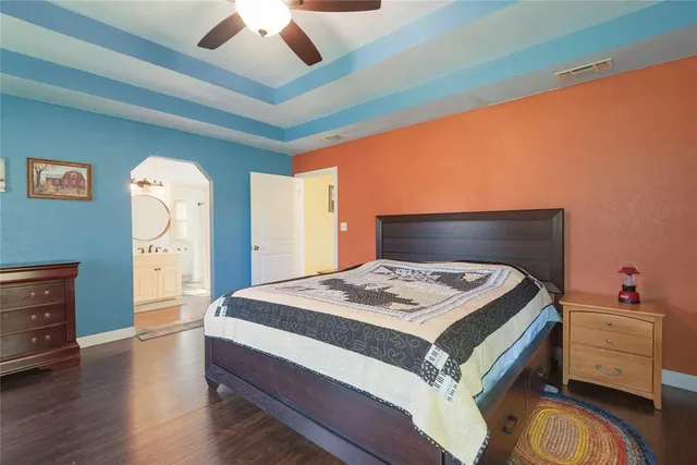 a bedroom with a bed and a dresser