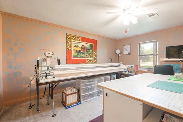 a kitchen with a stove a sink and a refrigerator