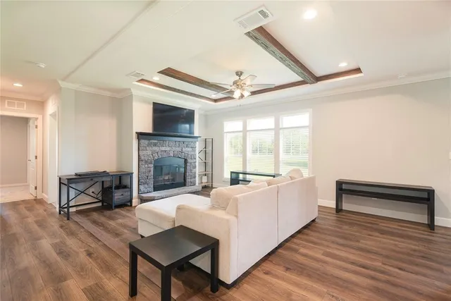 a living room with furniture fireplace and flat screen tv