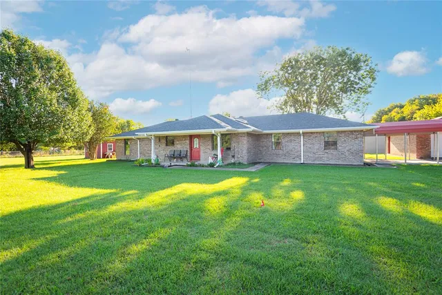 a view of an apartment with a garden and entertaining space