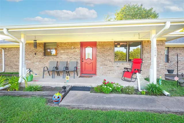 a house view with a sitting space and garden space
